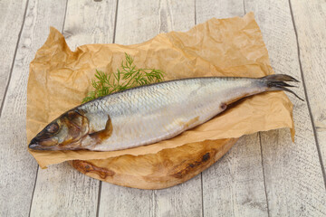 Salted herring over the wooden board