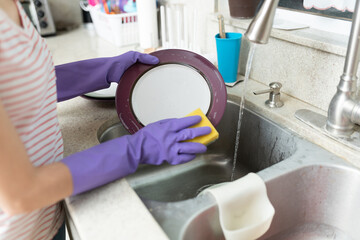 Washing the dishes in a kitchen