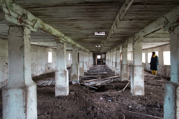 Abandoned building with columns. The gloomy place was empty and dilapidated, windows and doors