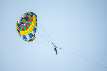 Parasailing in the blue sky of Cox's Bazar