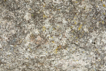 Rock covered with cracks. Natural stone texture.