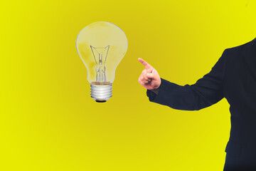 Businessman point to light bulb ,concept big idea .