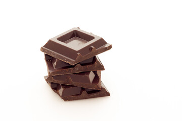 Cubes of dark chocolate white background