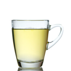 Glass mug of green tea in back lit