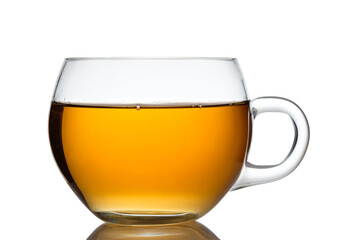Glass cup of orange black tea in back lit