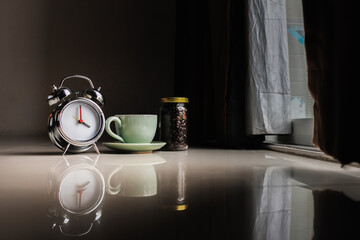 Smooth Focus and soft Focus,Hot coffee in a cup of coffee placed on the bedroom floor by the window in the morning was placed to prepare for drinking coffee before work.
