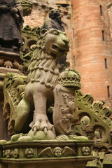 Fototapeta na wymiar Linlithgow, Scotland - January 23 2016: Lion Sculpture on a fountain at Linlithgow Palace, Linlithgow, Scotland
