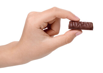Chocolate candy in boy's hand, isolated on white background.