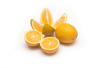 Orange fruit with orange slices and leaves isolated on white background.