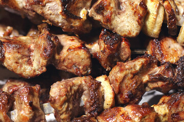 Grilled kebab. Roasted meat with onions. Background from food. Pork