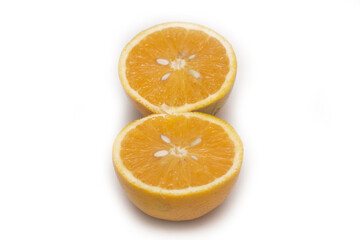Orange fruit with orange slices and leaves isolated on white background.