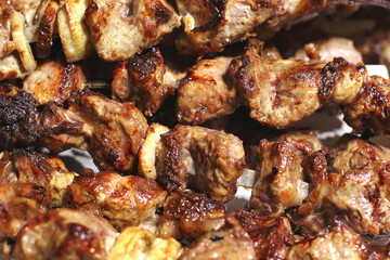 Grilled kebab. Roasted meat with onions. Background from food. Pork