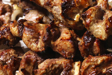 Grilled kebab. Roasted meat with onions. Background from food. Pork
