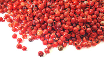 pink peppercorn close up , on white background.