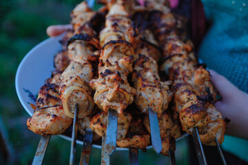 Offers skewered fried meat for consumption