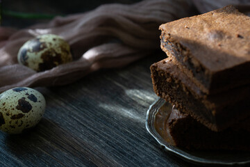 Chocolate brownie on quail eggs