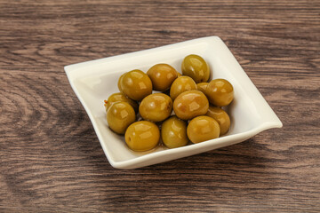 Green pickled olives in the bowl