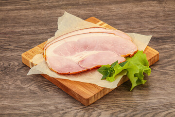 Sliced pork belly over board