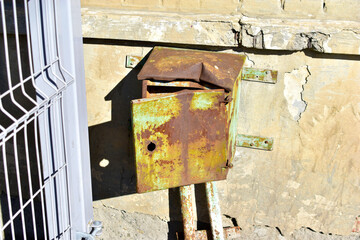 Old rusty deformed iron transformer electric box