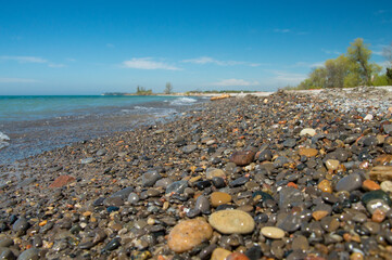 Close up of a rocky beach on a sunny summer day