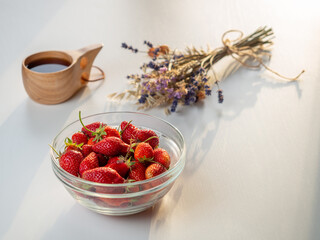 Still life of fresh strawberries tea and lavender