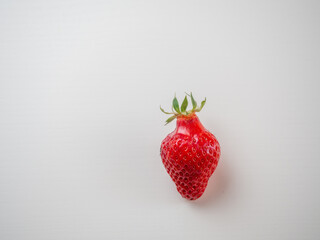 Red strawberry fruit on white background