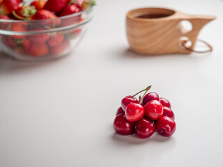 Sweet red cherries on white