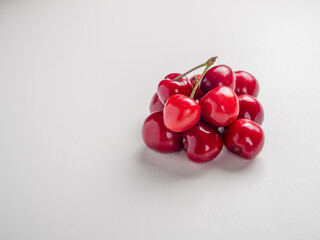 Sweet red cherries on white