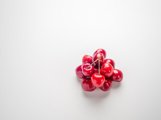 Sweet red cherries on white