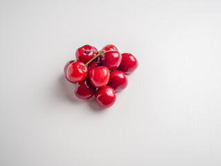 Sweet red cherries on white