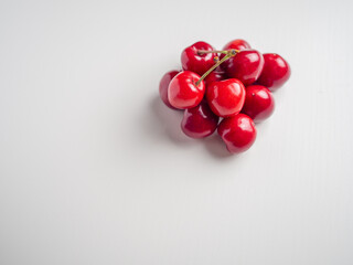Sweet red cherries on white