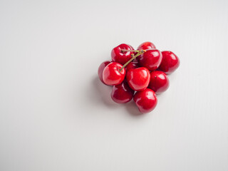Sweet red cherries on white