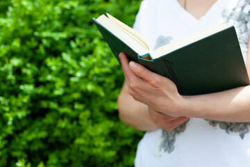 woman hand book in street