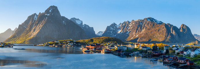 Famous Norwegian Reine The Fishing village  , Lofoten Islands,  Norway.Mountains With Snow In...