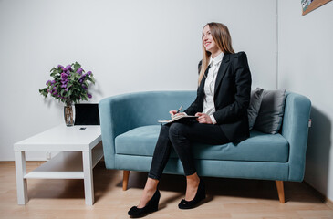 business and beautiful woman working in the office at the computer