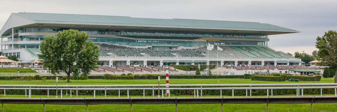 Banner Sized Picture Of The Grandstand At Arlington Park International Race Course Taken From Across The Race Track In The Summer.