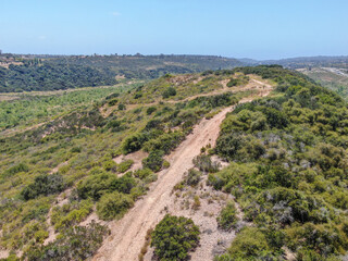 Fototapeta na wymiar Aerial view of of small dry rocky trails in the mountain, San Diego, California, USA