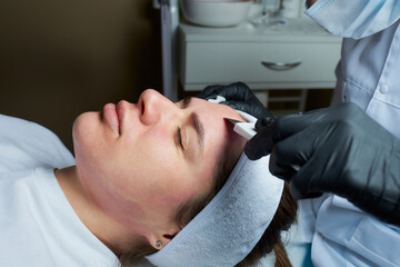 Photo of the girl's face after a warming lotion during an ultrasonic procedure