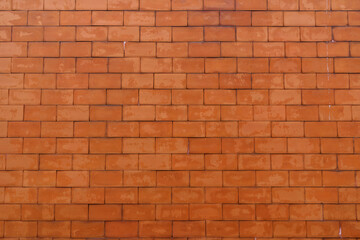 Orange brick patterned brick wall background, wall texture and backdrop for architectural materials