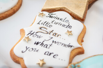 Homemade gingerbread cookie with "Twinkle, twinkle little star" text. Close up.