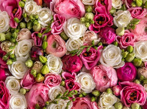 Flower box full of pink, white, red and blush colored blooming flowers, closeup photo from above