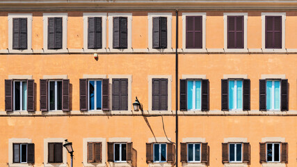 Fototapeta na wymiar Buiding wall with windows in Campo de' Fiori in Rome, Italy.