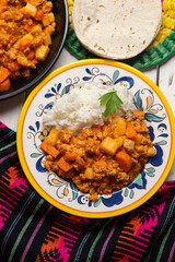 Mexican picadillo with rice on white background