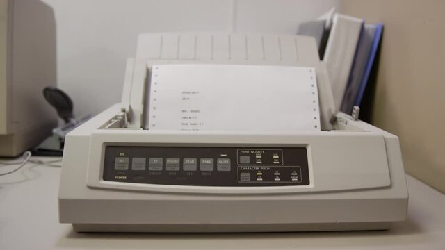 Old 9-pin Dot Matrix Printer Prints On Perforated Paper