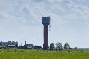 water tower from afar against the blue sky