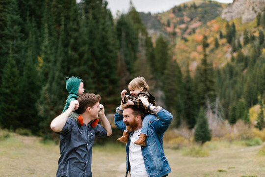 USA, Utah, Salt Lake City, Fathers with children (12-17 months) on shoulders