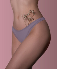 Flowers in pink shorts on a blue background in bikini area. Vagina