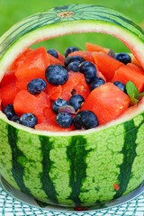 Watermelon and blueberry salad in a watermelon basket