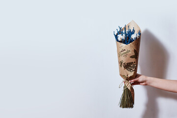 Bouquet of lavender in hand on a white background copy space
