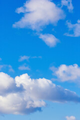 Naklejka na ściany i meble texture of fluffy clouds against a blue sky and fresh air